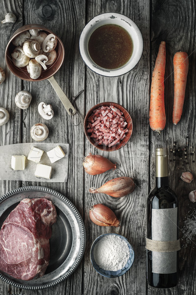 Ingredients for Boeuf Bourguignon on the old wooden table top view Stock photo © Karpenkovdenis
