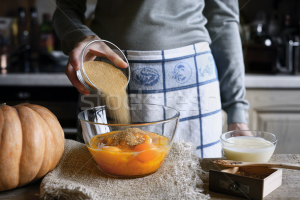 Adding sugar in the dough for pumpkin dump cake horizontal Stock photo © Karpenkovdenis