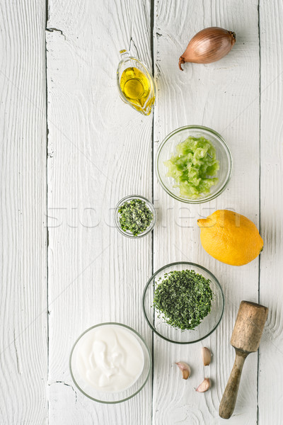 Natural yogurt and different seasoning on the white wooden table Stock photo © Karpenkovdenis