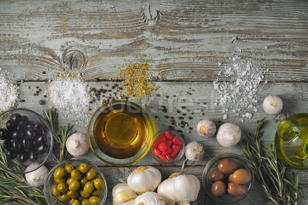 Stock photo: Olives with seasoning mix on the blue wooden table top view