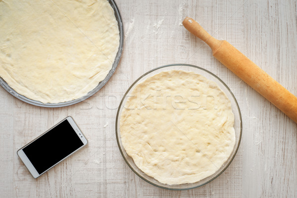 Ready dough for pizzas in forms for baking Stock photo © Karpenkovdenis
