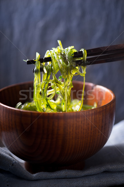 Chinese chopsticks with chuka salad vertical Stock photo © Karpenkovdenis