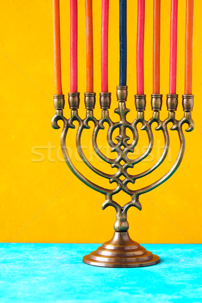 Hanukkah menorah with candles on the yellow background vertical Stock photo © Karpenkovdenis