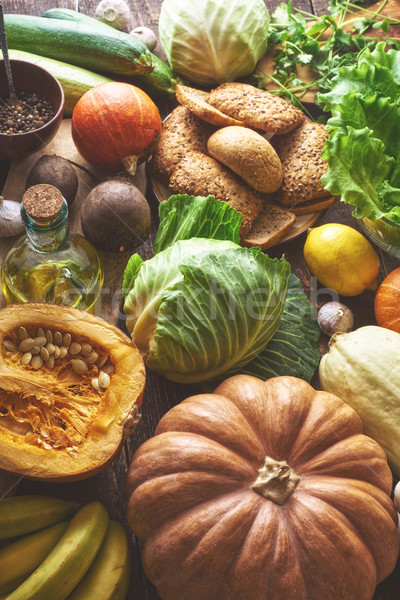 Stock photo: Grain bread with different vegetable on the wooden table vertical. Concept of healthy food