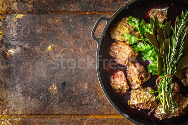 Boeuf Bourguignon with herbs in the pan on the metal background top view Stock photo © Karpenkovdenis