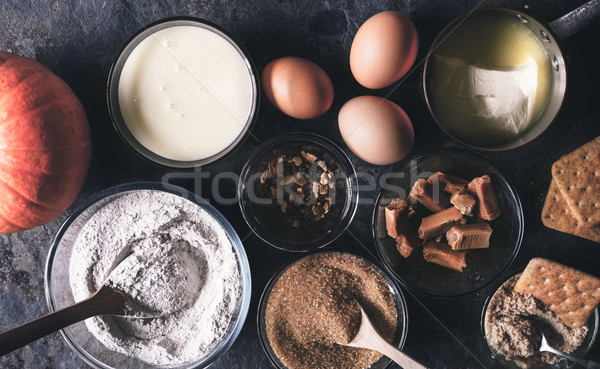 Ingredients for  pumpkin dump cake on the dark stone background top view Stock photo © Karpenkovdenis