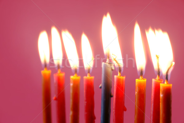 Hanukkah  burning candles on the pink background Stock photo © Karpenkovdenis