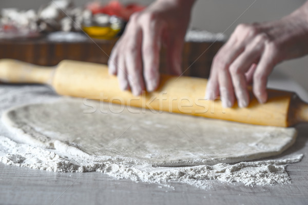 Rolling dough for calzone horizontal Stock photo © Karpenkovdenis