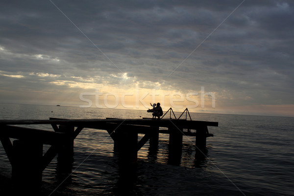 Familia feliz mar paisaje puesta de sol foto playa Foto stock © kash76