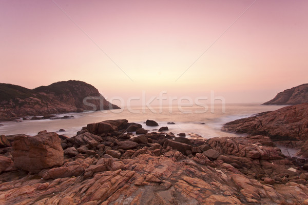 Sea stones along the coast at sunrise Stock photo © kawing921