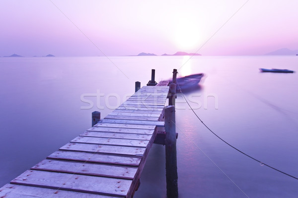 Zonsondergang pier paars stemming hout zee Stockfoto © kawing921