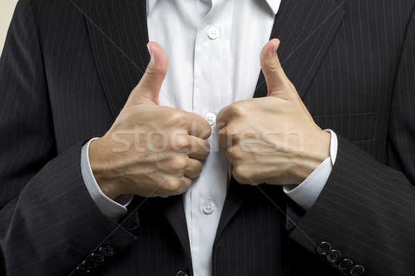 Business man with thumbs up, means successful deal. Stock photo © kawing921