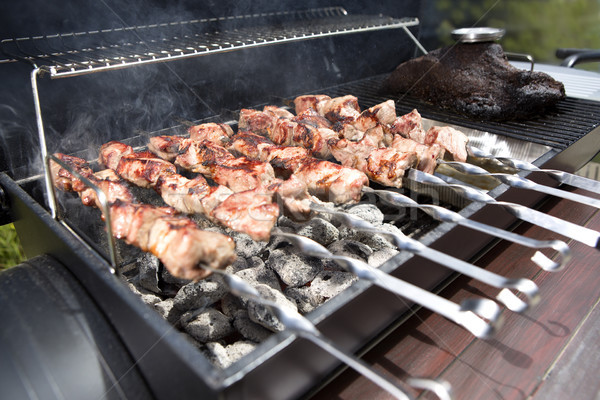 Grilling shashlik on a barbeque grill outdoor Stock photo © kb-photodesign