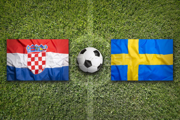 Stock photo: Croatia vs. Sweden flags on soccer field
