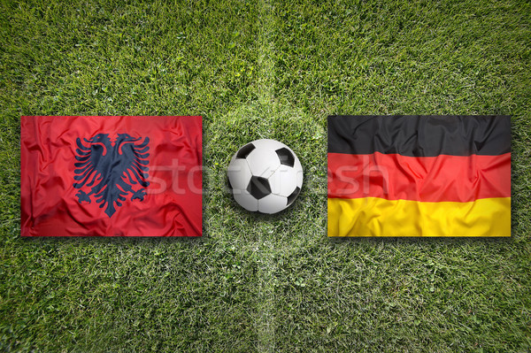 [[stock_photo]]: Vs · drapeaux · terrain · de · football · vert · équipe · balle