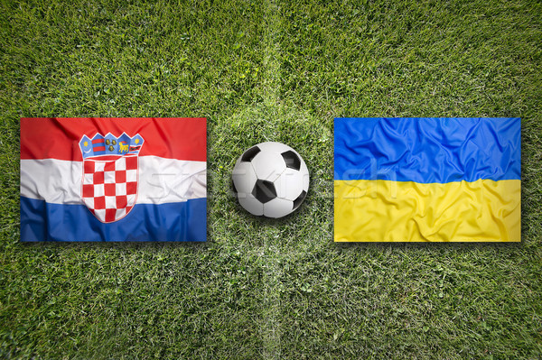 Croatia vs. Ukraine flags on soccer field Stock photo © kb-photodesign