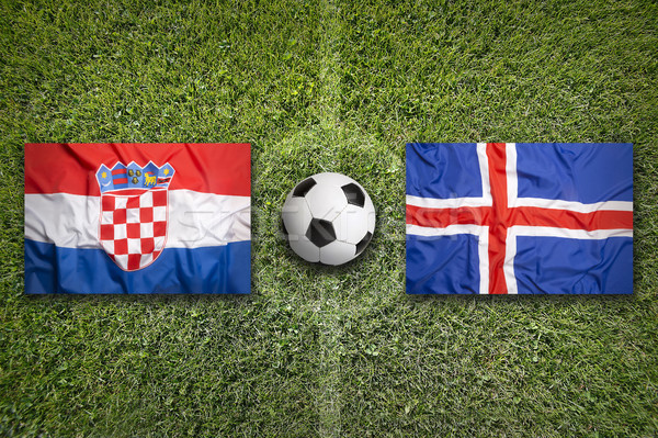 Stock photo: Croatia vs. Iceland flags on soccer field