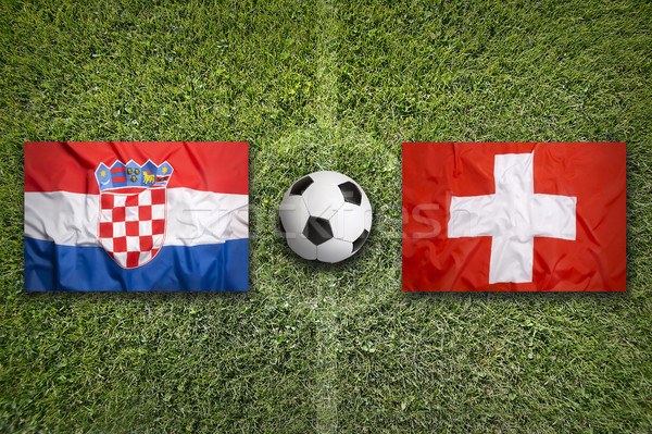 Stock photo: Croatia vs. Switzerland flags on soccer field