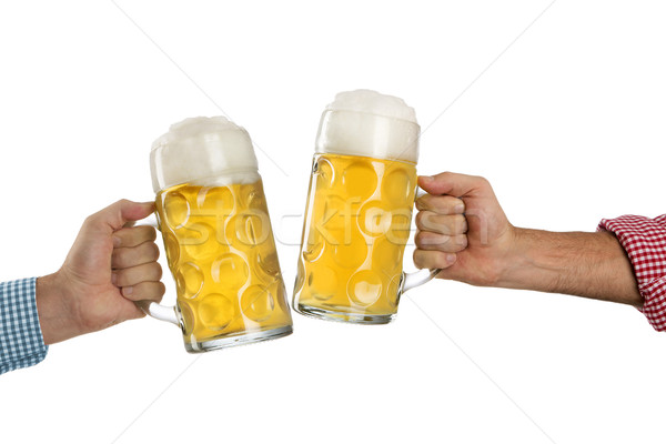 Cheers at the Oktoberfest in front of a white background Stock photo © kb-photodesign