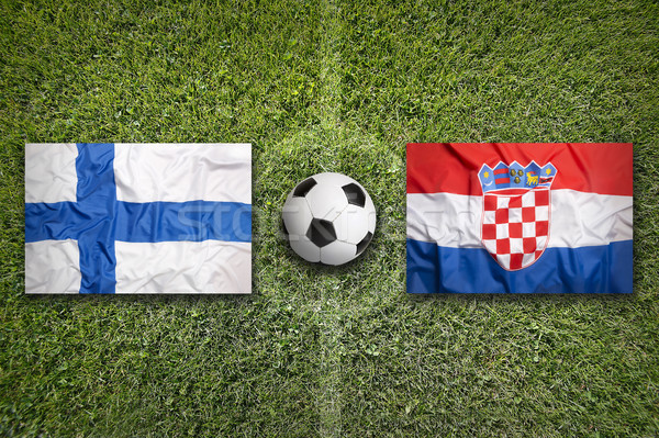 Stock photo: Finland vs. Croatia flags on soccer field