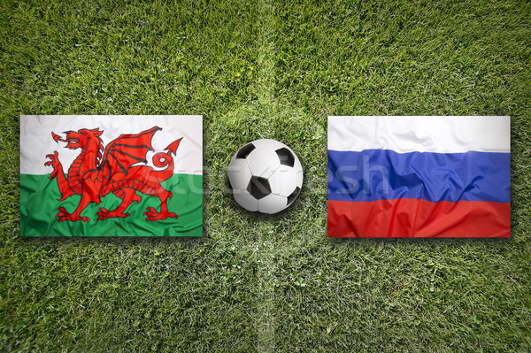 Pays de galles vs Russie drapeaux terrain de football vert [[stock_photo]] © kb-photodesign