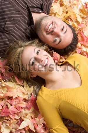 Young Couple in Leaves Stock photo © keeweeboy