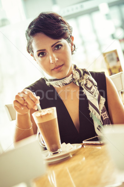 Woman Stirring Coffee Drink Stock photo © keeweeboy