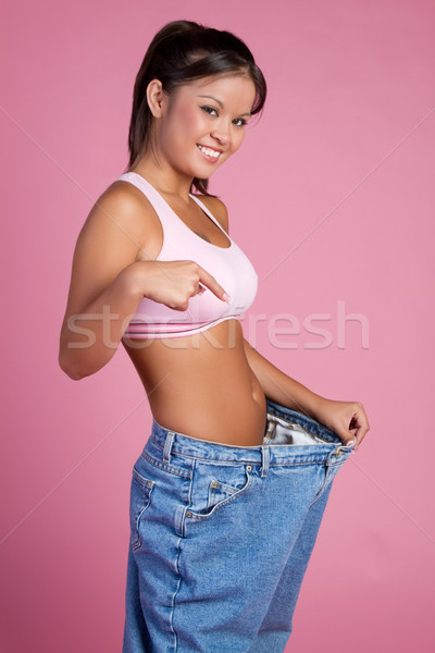 Kadın büyük pantolon kız mutlu Stok fotoğraf © keeweeboy