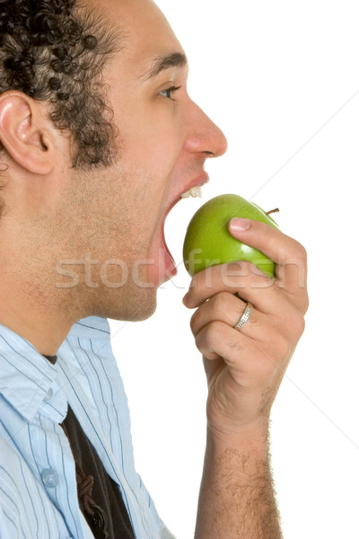 Férfi eszik alma fiatalember zöld arc Stock fotó © keeweeboy