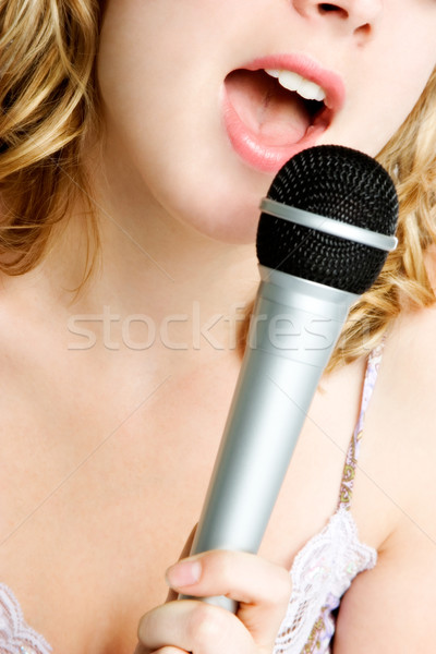 Cantando micrófono nina hermosa primer plano mujer Foto stock © keeweeboy
