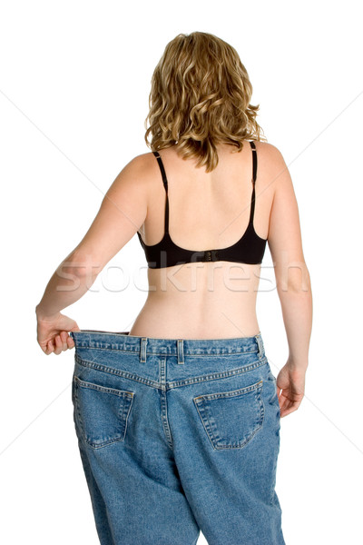 Fogyókúra nő izolált súly nadrág súlycsökkentés Stock fotó © keeweeboy