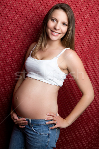 Mulher grávida belo sorridente jovem cara feliz Foto stock © keeweeboy
