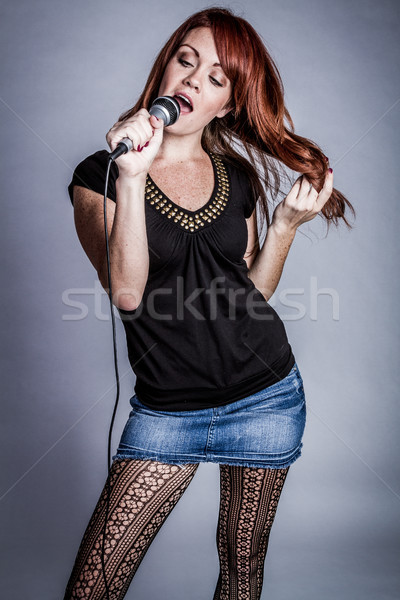 Singing Into Microphone Stock photo © keeweeboy
