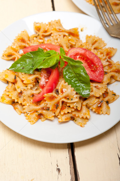 Italian pasta farfalle butterfly bow-tie and tomato sauce Stock photo © keko64