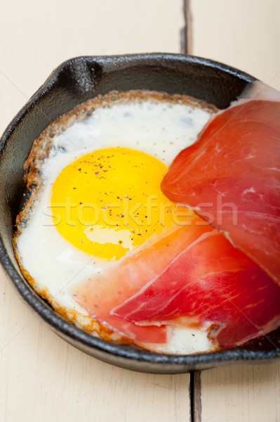egg sunny side up with italian speck ham Stock photo © keko64