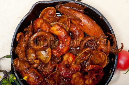 fresh seafoos stew on an iron skillet Stock photo © keko64
