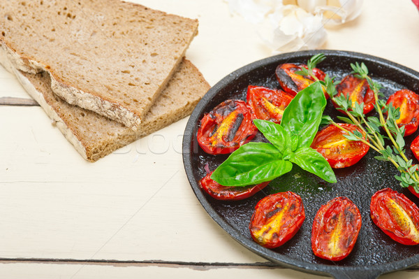 baked cherry tomatoes with basil and thyme Stock photo © keko64