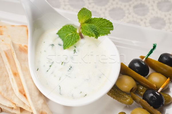 Stock photo: Greek Tzatziki yogurt dip and pita bread