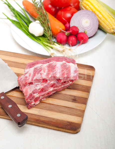 chopping fresh pork ribs and vegetables Stock photo © keko64