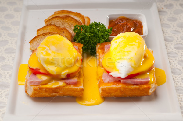 eggs benedict on bread with tomato and ham Stock photo © keko64