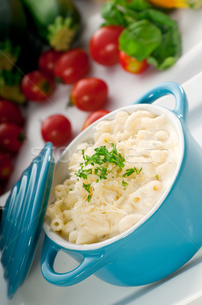 mac and cheese on a blue little clay pot Stock photo © keko64