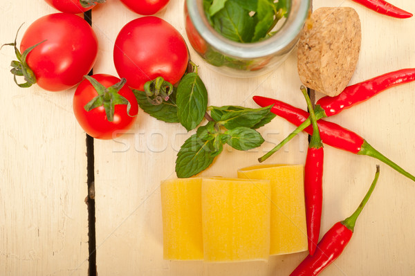 Italian pasta paccheri with tomato mint and chili pepper Stock photo © keko64