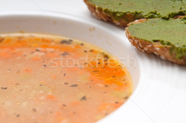 Italian minestrone soup with pesto crostini on side Stock photo © keko64