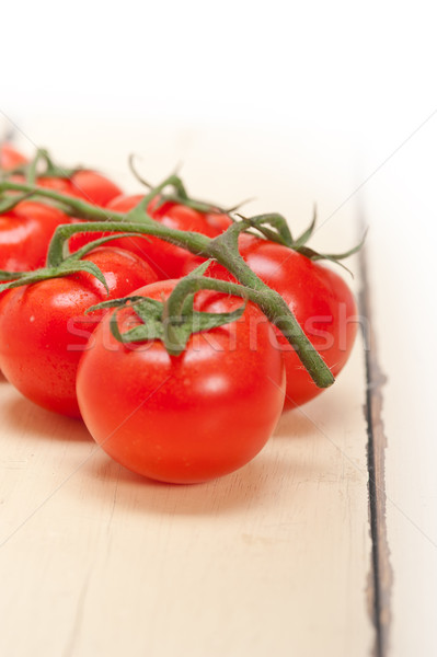 fresh cherry tomatoes on a cluster Stock photo © keko64