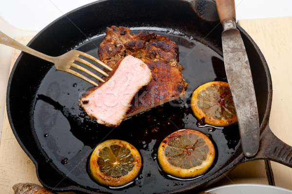 pork chop seared on iron skillet Stock photo © keko64