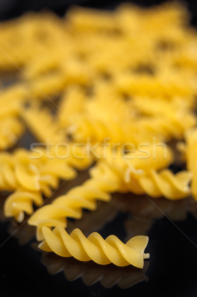 Italian pasta fusilli over black Stock photo © keko64