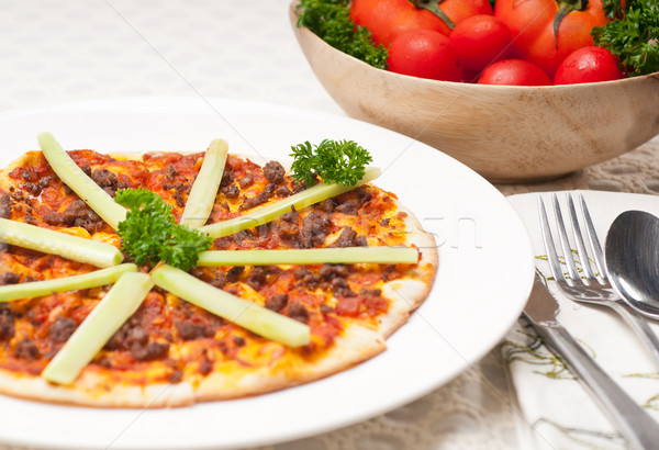 Turkish beef pizza with cucumber on top Stock photo © keko64