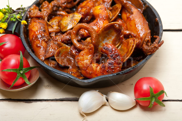fresh seafoos stew on an iron skillet Stock photo © keko64