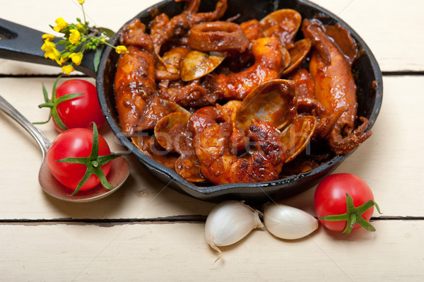fresh seafoos stew on an iron skillet Stock photo © keko64