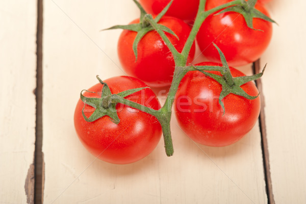 Stock photo: fresh cherry tomatoes on a cluster